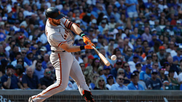 SF Giants third baseman Evan Longoria connects with a pitch against the Cubs. (2021)
